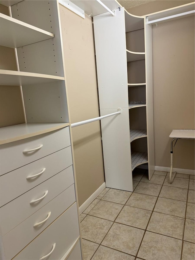 2400 Forest Dr Unit 219, Inverness, FL 34453 - walk in closet with light tile patterned floors