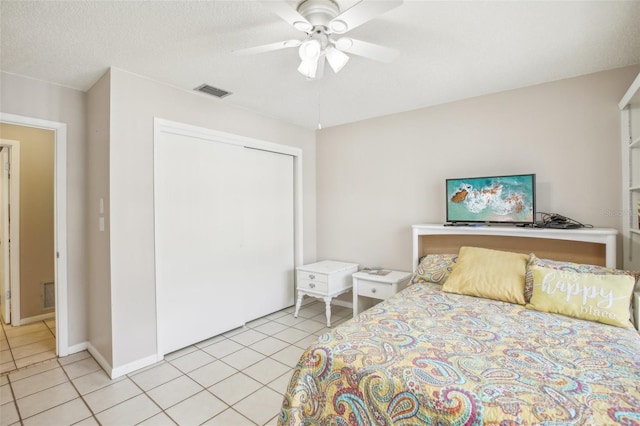 2400 Forest Dr Unit 219, Inverness, FL 34453 - bedroom featuring light tile patterned flooring, a closet, and ceiling fan