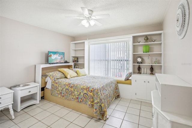2400 Forest Dr Unit 219, Inverness, FL 34453 - bedroom with a ceiling fan, a textured ceiling, and light tile patterned floors