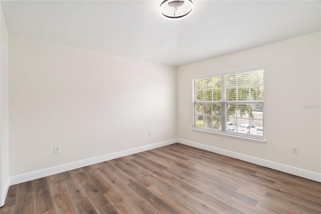 6484 S Goldenrod Rd Unit 41A, Orlando, FL 32822 - spare room with wood finished floors and baseboards