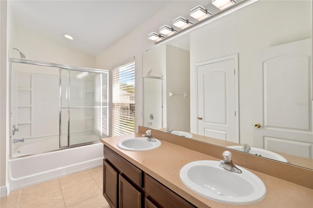 6484 S Goldenrod Rd Unit 41A, Orlando, FL 32822 - bathroom featuring tile patterned floors, double vanity, and enclosed tub / shower combo