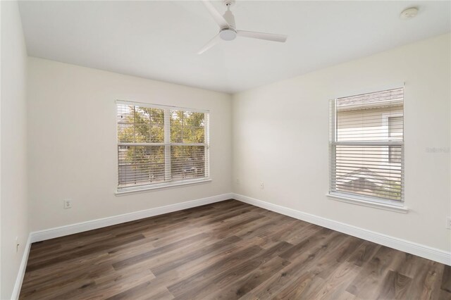 6484 S Goldenrod Rd Unit 41A, Orlando, FL 32822 - empty room featuring a smoke detector, dark wood finished floors, and ceiling fan