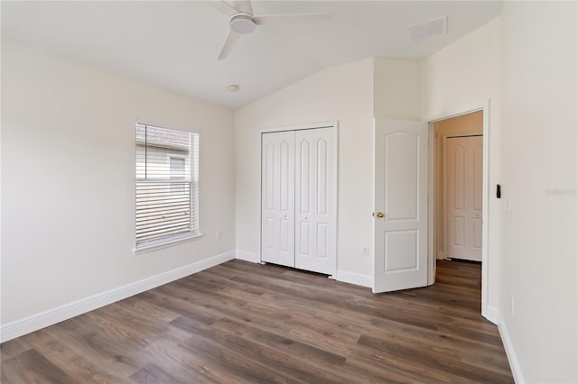 6484 S Goldenrod Rd Unit 41A, Orlando, FL 32822 - unfurnished bedroom featuring lofted ceiling, dark wood-style flooring, a closet, and a ceiling fan