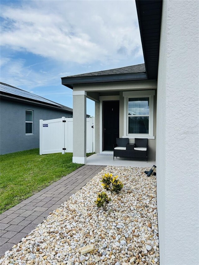 2824 Neverland Dr, New Smyrna Beach, FL 32168 - entrance to property featuring stucco siding and covered porch