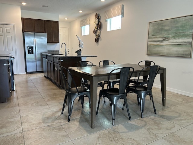 2824 Neverland Dr, New Smyrna Beach, FL 32168 - dining space with recessed lighting and baseboards