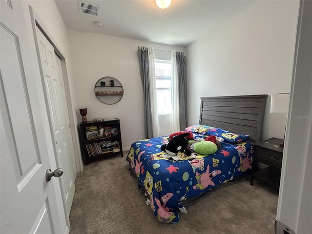 2824 Neverland Dr, New Smyrna Beach, FL 32168 - bedroom featuring carpet flooring and a closet