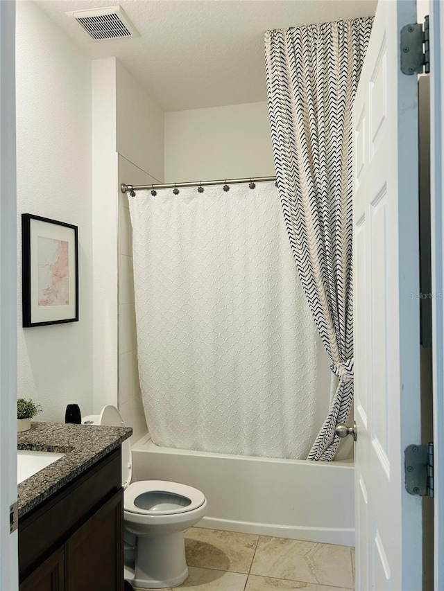 2824 Neverland Dr, New Smyrna Beach, FL 32168 - bathroom featuring shower / tub combo with curtain, vanity, and tile patterned flooring