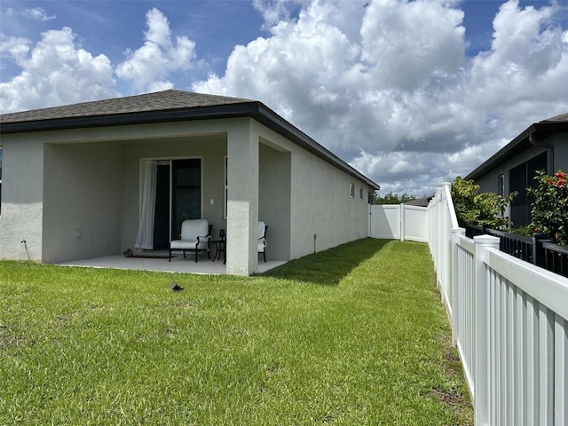 2824 Neverland Dr, New Smyrna Beach, FL 32168 - back of house with stucco siding and a patio