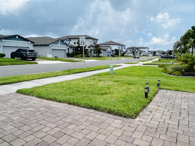 2824 Neverland Dr, New Smyrna Beach, FL 32168 - view of green lawn with a residential view