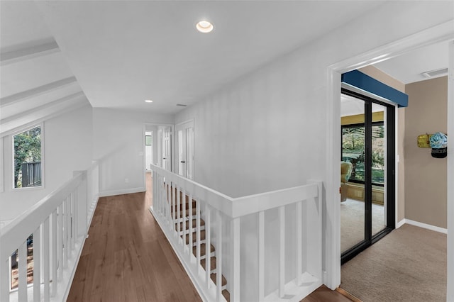 4702 Shorecrest Dr, Orlando, FL 32817 - hallway with an upstairs landing, plenty of natural light, recessed lighting, and wood finished floors