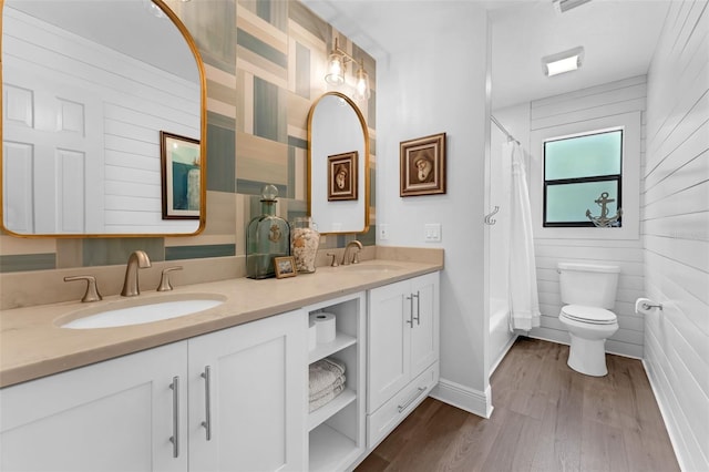 4702 Shorecrest Dr, Orlando, FL 32817 - bathroom with double vanity, wood finished floors, and shower / bath combo