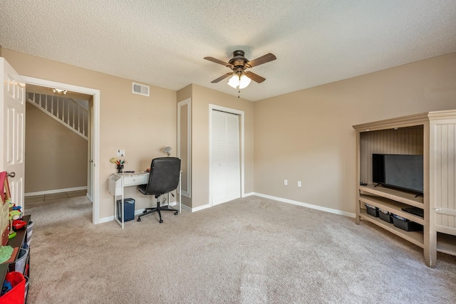 100 Monterey Oaks Dr, Sanford, FL 32771 - home office with a ceiling fan, carpet, and a textured ceiling
