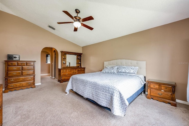 100 Monterey Oaks Dr, Sanford, FL 32771 - bedroom with arched walkways, carpet floors, vaulted ceiling, and a ceiling fan