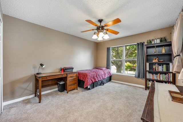 100 Monterey Oaks Dr, Sanford, FL 32771 - bedroom with a textured ceiling, light carpet, and a ceiling fan