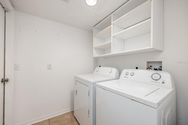 100 Monterey Oaks Dr, Sanford, FL 32771 - washroom featuring washer and clothes dryer and light tile patterned floors