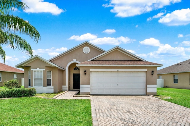 2713 Eagle Glen Cir, Kissimmee, FL 34746 - ranch-style home featuring stucco siding, decorative driveway, a garage, a front yard, and roof with shingles