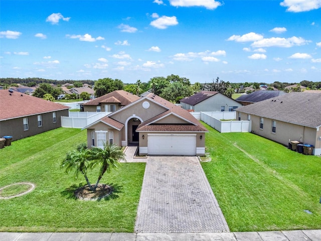 2713 Eagle Glen Cir, Kissimmee, FL 34746 - view of front facade featuring a garage, a residential view, decorative driveway, and stucco siding