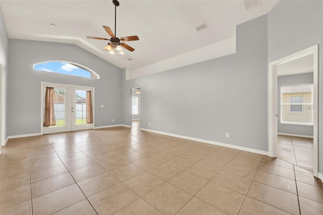 2713 Eagle Glen Cir, Kissimmee, FL 34746 - unfurnished room featuring ceiling fan, light tile patterned flooring, high vaulted ceiling, and french doors