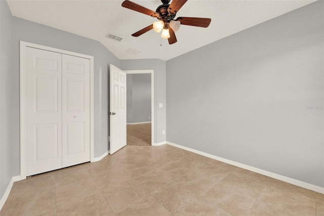 2713 Eagle Glen Cir, Kissimmee, FL 34746 - unfurnished bedroom with light tile patterned floors, a closet, and ceiling fan