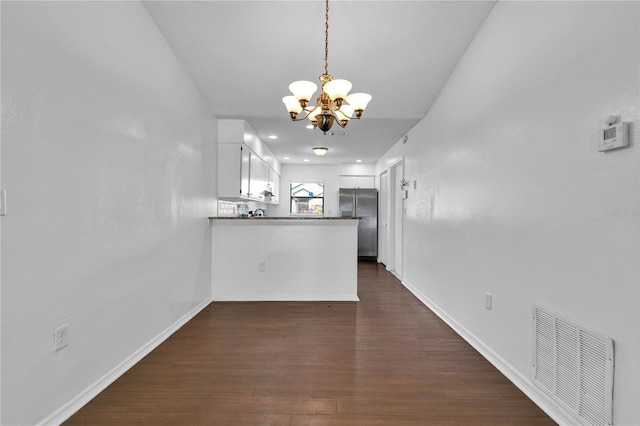 845 Valnera Ct, Kissimmee, FL 34758 - unfurnished dining area with a chandelier and dark wood-style flooring