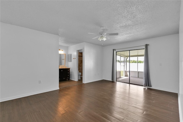 845 Valnera Ct, Kissimmee, FL 34758 - spare room featuring a ceiling fan, a textured ceiling, and dark wood finished floors