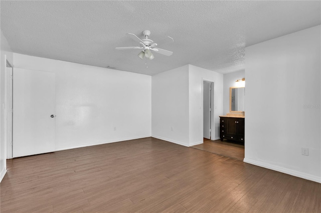 845 Valnera Ct, Kissimmee, FL 34758 - unfurnished room featuring ceiling fan, wood finished floors, and a textured ceiling