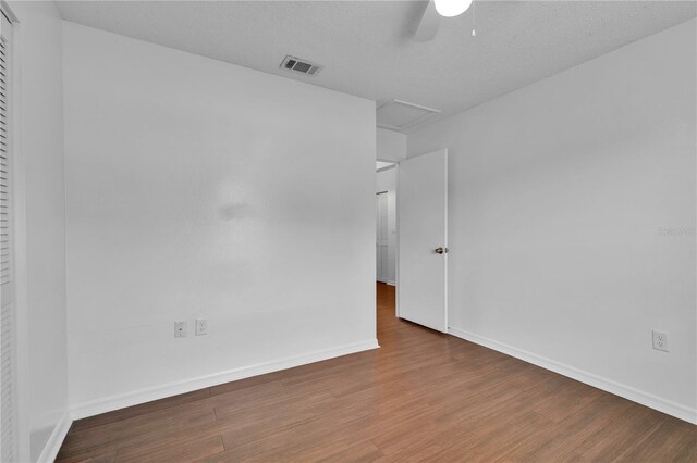 845 Valnera Ct, Kissimmee, FL 34758 - unfurnished room featuring ceiling fan, wood finished floors, and attic access