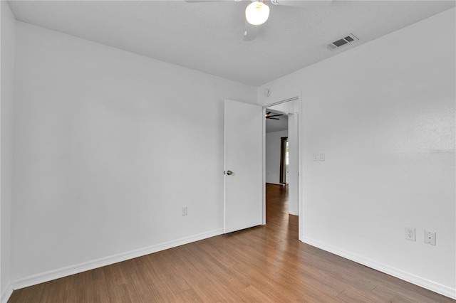 845 Valnera Ct, Kissimmee, FL 34758 - empty room with a ceiling fan and wood finished floors