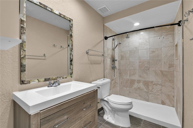 845 Valnera Ct, Kissimmee, FL 34758 - full bathroom featuring vanity, tiled shower, and a textured wall