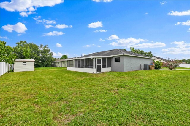 845 Valnera Ct, Kissimmee, FL 34758 - rear view of property with a sunroom and an outdoor structure