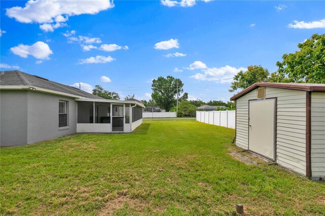 845 Valnera Ct, Kissimmee, FL 34758 - view of yard with a sunroom and a storage unit