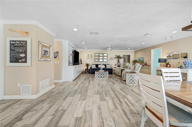231 Ocean Blvd, Satellite Beach, FL 32937 - dining area featuring light wood finished floors, a ceiling fan, a textured ceiling, crown molding, and recessed lighting