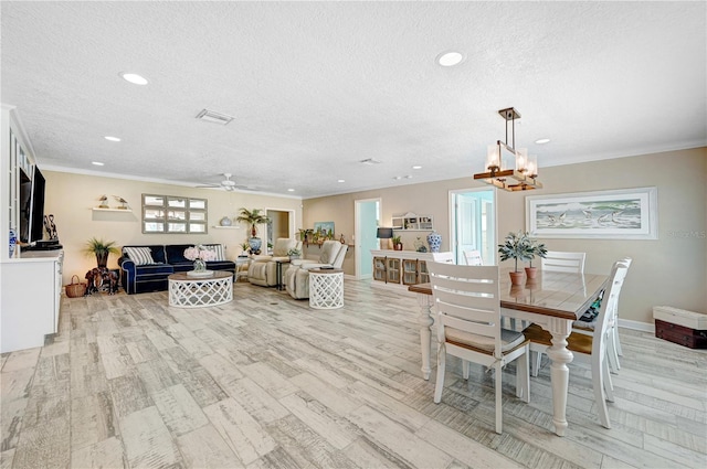 231 Ocean Blvd, Satellite Beach, FL 32937 - dining space with a textured ceiling, light wood-style floors, ceiling fan, recessed lighting, and crown molding