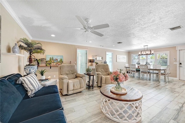 231 Ocean Blvd, Satellite Beach, FL 32937 - living area with ceiling fan, crown molding, a chandelier, a textured ceiling, and recessed lighting
