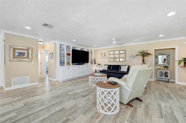 231 Ocean Blvd, Satellite Beach, FL 32937 - living area featuring a textured ceiling, ceiling fan, light wood-style floors, crown molding, and recessed lighting