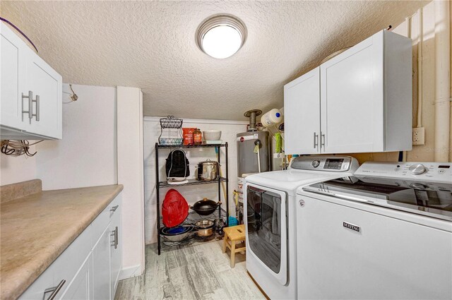 231 Ocean Blvd, Satellite Beach, FL 32937 - laundry area with cabinet space, washing machine and dryer, light wood-style floors, a textured ceiling, and gas water heater