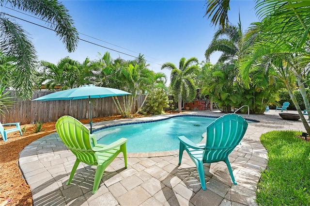 231 Ocean Blvd, Satellite Beach, FL 32937 - view of swimming pool with a fenced backyard and a patio