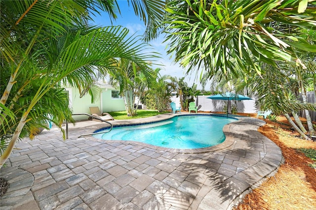 231 Ocean Blvd, Satellite Beach, FL 32937 - swimming pool featuring a patio area and a fenced backyard