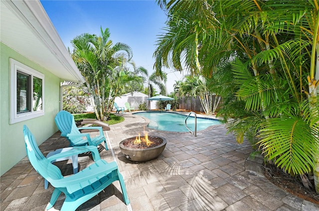 231 Ocean Blvd, Satellite Beach, FL 32937 - view of pool featuring a patio area, a fenced backyard, and a fire pit