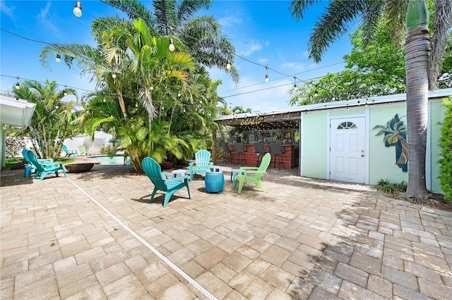 231 Ocean Blvd, Satellite Beach, FL 32937 - view of patio featuring an outdoor fire pit