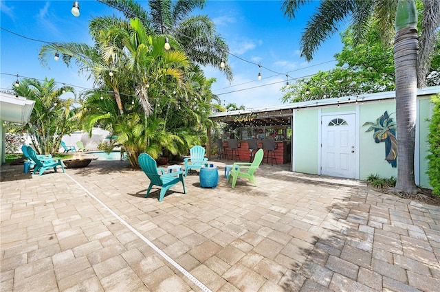 231 Ocean Blvd, Satellite Beach, FL 32937 - view of patio / terrace featuring a fire pit