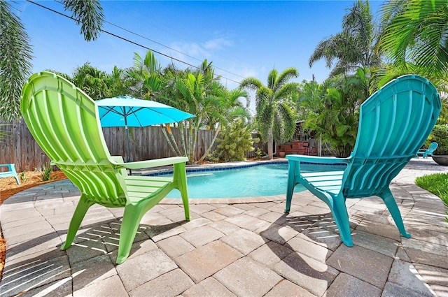 231 Ocean Blvd, Satellite Beach, FL 32937 - view of swimming pool featuring a patio and a fenced backyard