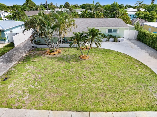 231 Ocean Blvd, Satellite Beach, FL 32937 - ranch-style home featuring decorative driveway, a gate, and a residential view