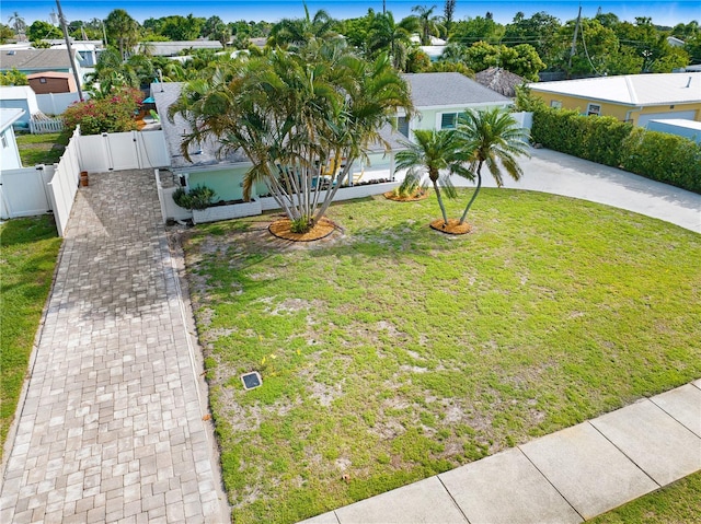 231 Ocean Blvd, Satellite Beach, FL 32937 - view of front of home with curved driveway, a gate, and a residential view