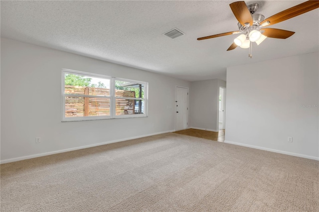 879 Tamerlane St, Deltona, FL 32725 - empty room featuring carpet floors, a ceiling fan, and a textured ceiling