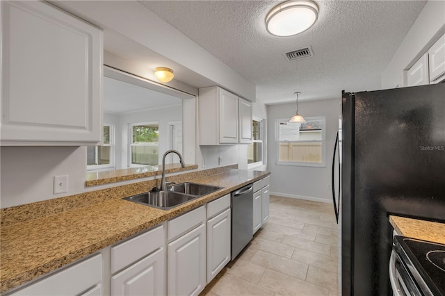 879 Tamerlane St, Deltona, FL 32725 - kitchen featuring stainless steel dishwasher, white cabinets, and a textured ceiling