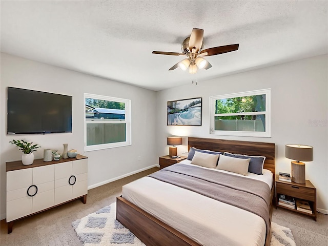 879 Tamerlane St, Deltona, FL 32725 - bedroom with light carpet, multiple windows, and a ceiling fan