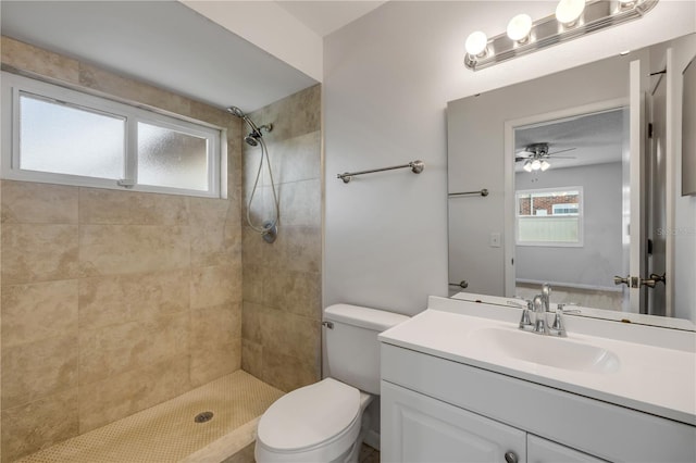 879 Tamerlane St, Deltona, FL 32725 - bathroom with a tile shower, vanity, and ceiling fan