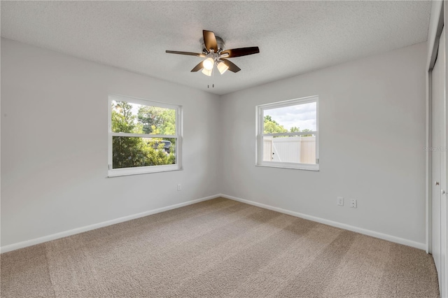 879 Tamerlane St, Deltona, FL 32725 - carpeted spare room with healthy amount of natural light, a ceiling fan, and a textured ceiling