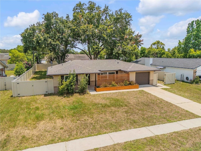 879 Tamerlane St, Deltona, FL 32725 - mid-century modern home with a gate, driveway, an attached garage, and roof with shingles